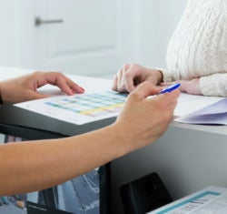 A front office team member discusses a patient's next appointment.